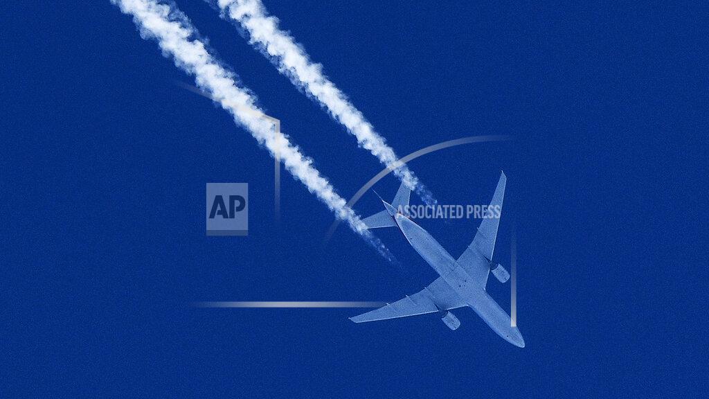 Martin Meissner A plane is pictured flying under a blue sky over Gelsenkirchen, Germany, when most air traffic in Europe is canceled due to the coronavirus outbreak on Thursday, April 23, 2020. (AP Photo/Martin Meissner)