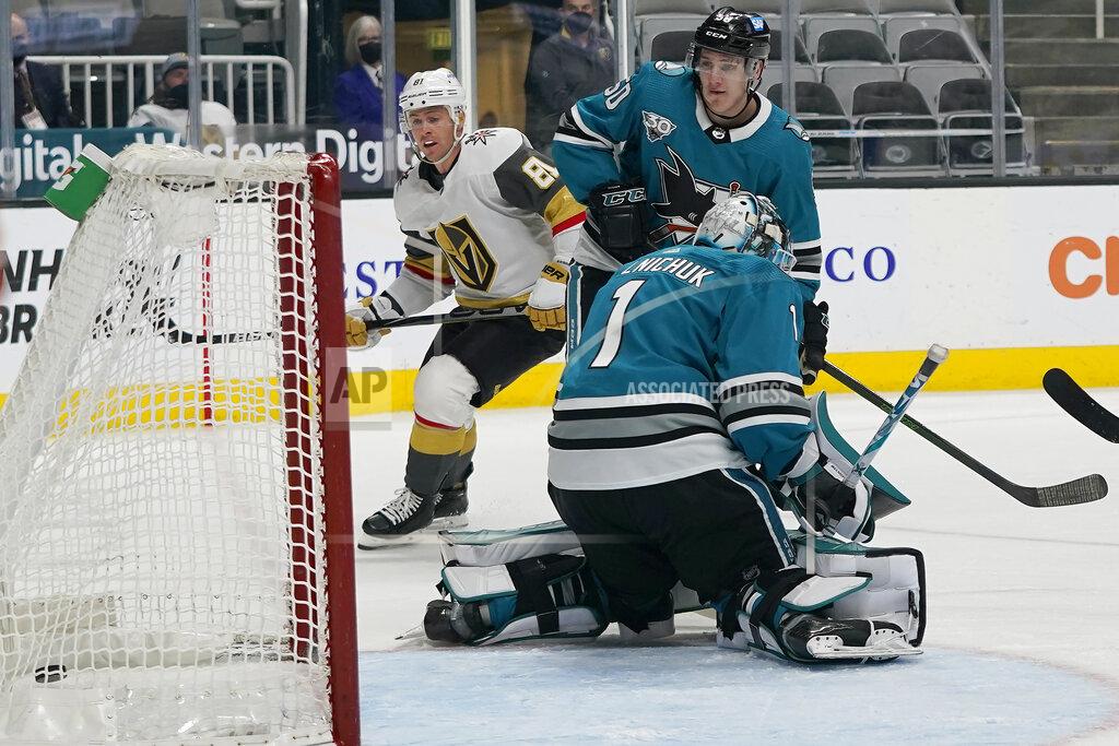 Jeff Chiu Vegas Golden Knights center Jonathan Marchessault, left, looks toward the goal after scoring past San Jose Sharks goaltender Alexei Melnichuk (1) during the first period of an NHL hockey game in San Jose, Calif., Wednesday, May 12, 2021. (AP Photo/Jeff Chiu)