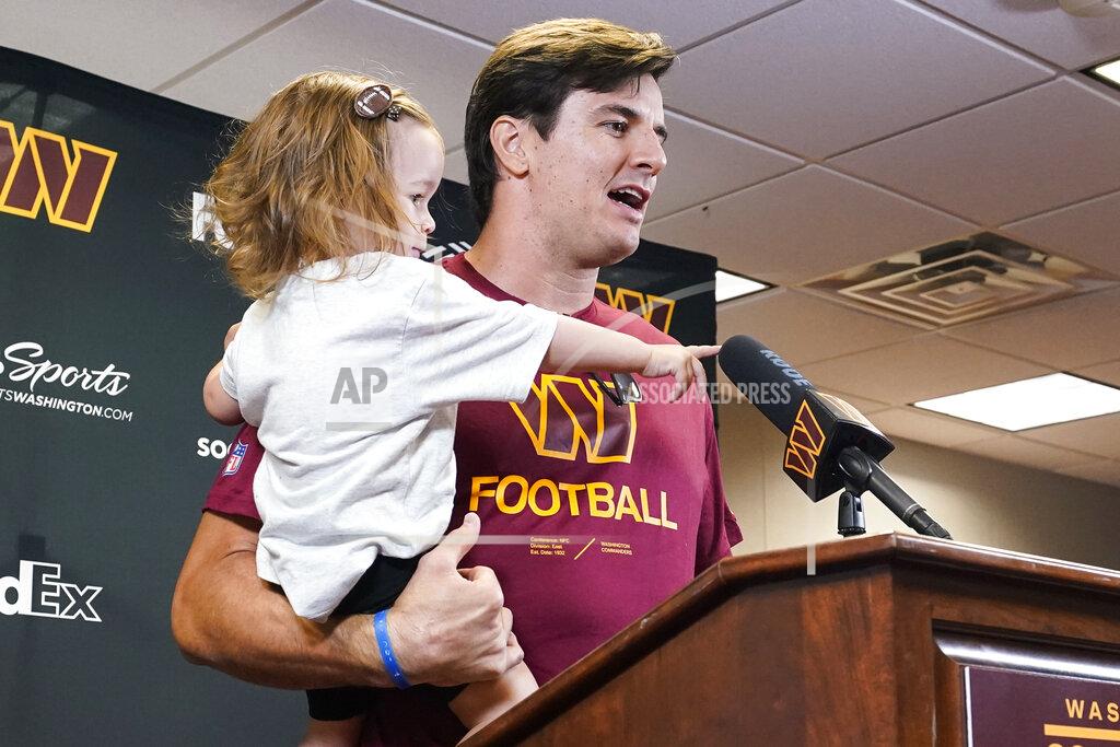 Alex Brandon Former Washington player Ryan Kerrigan holds his daughter Hayes Kerrigan as he speaks with reporters about his recent retirement at the Washington Commanders' NFL football training facility, Saturday, July 30, 2022 in Ashburn, Va. (AP Photo/Alex Brandon)