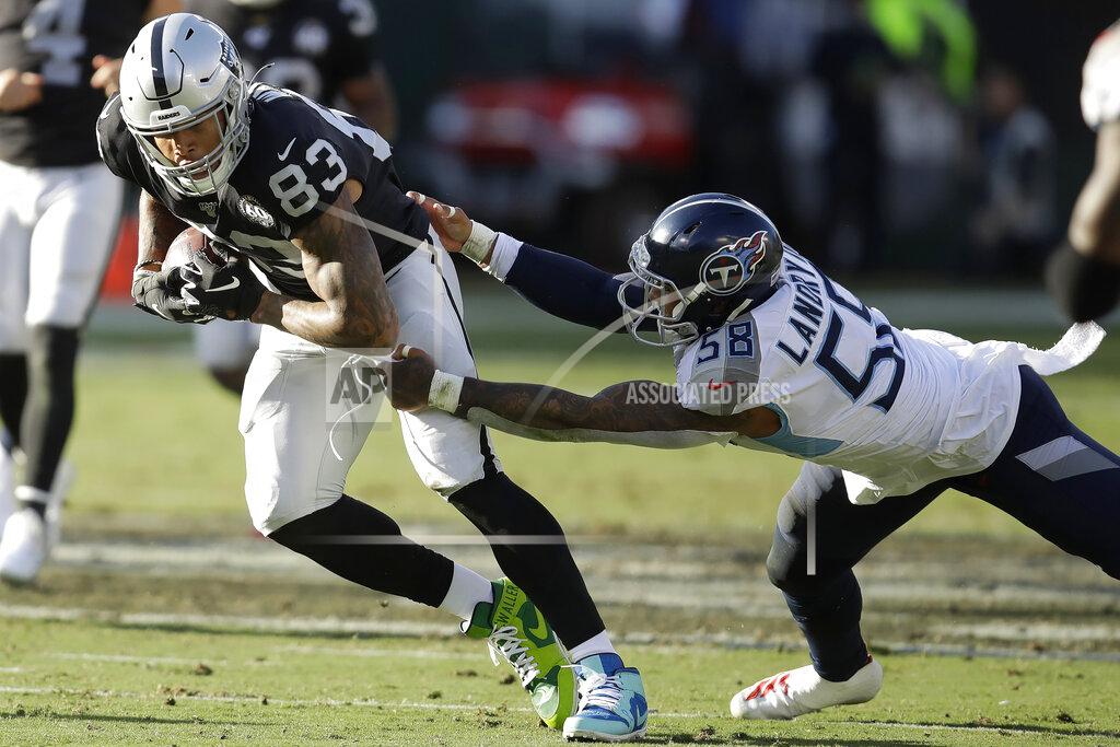 Ben Margot FILE - In this Dec. 8, 2019, file photo, Oakland Raiders tight end Darren Waller (83) runs past Tennessee Titans linebacker Harold Landry (58) during the first half of an NFL football game in Oakland, Calif. Waller has become many things since joining the Raiders organization. A well-rounded tight end, a leader on and off the field, an inspiration to his teammates and fans, and now, a bargain. (AP Photo/Ben Margot, File)