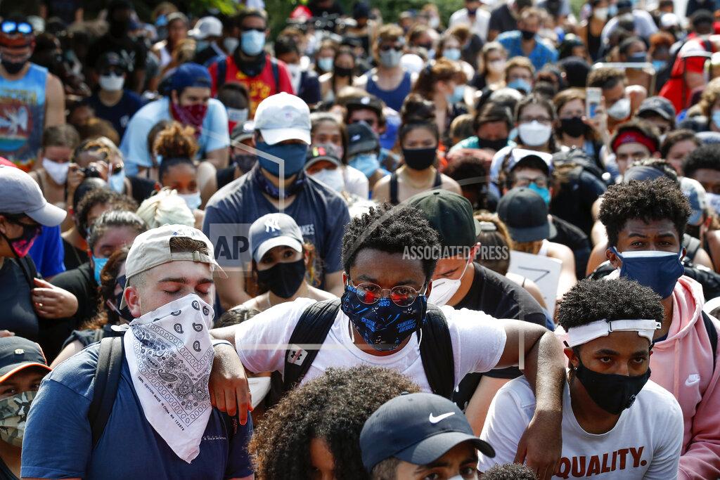 Alex Brandon Demonstrators protest Thursday, June 4, 2020, at the Martin Luther King Jr. Memorial in Washington, over the death of George Floyd, a black man who was in police custody in Minneapolis. Floyd died after being restrained by Minneapolis police officers. (AP Photo/Alex Brandon)