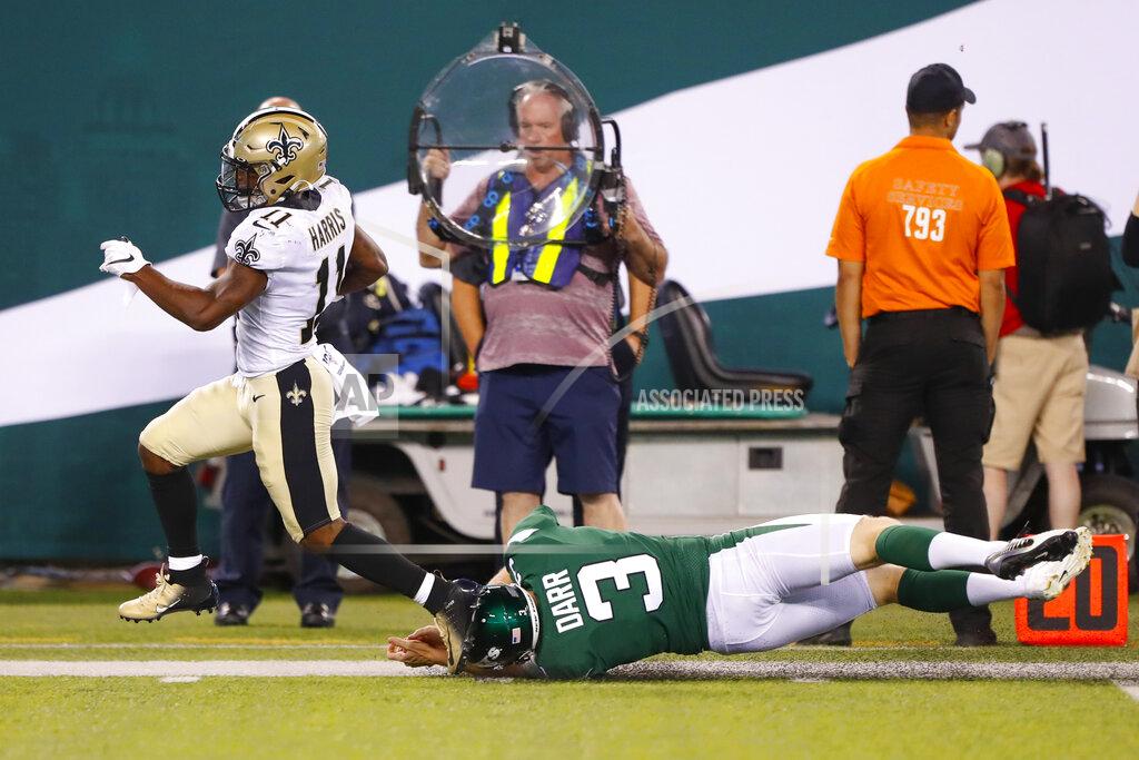 Noah K. Murray New Orleans Saints' Deonte Harris (11) breaks a tackle by New York Jets' Matt Darr (3) during the second half of a preseason NFL football game Saturday, Aug. 24, 2019, in East Rutherford, N.J. Harris scored a touchdown on the play. (AP Photo/Noah K. Murray)