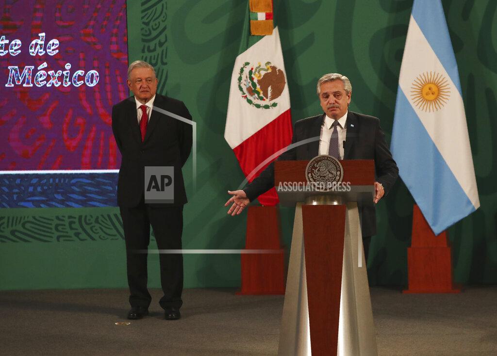 Marco Ugarte Argentina's President Alberto Fernández speaks during Mexican President Andrés Manuel López Obrador's daily, morning press conference, as Lopez Obrador stands behind at the National Palace in Mexico City, Tuesday, Feb. 23, 2021. Fernández is on a four-day official visit to Mexico. (AP Photo/Marco Ugarte)