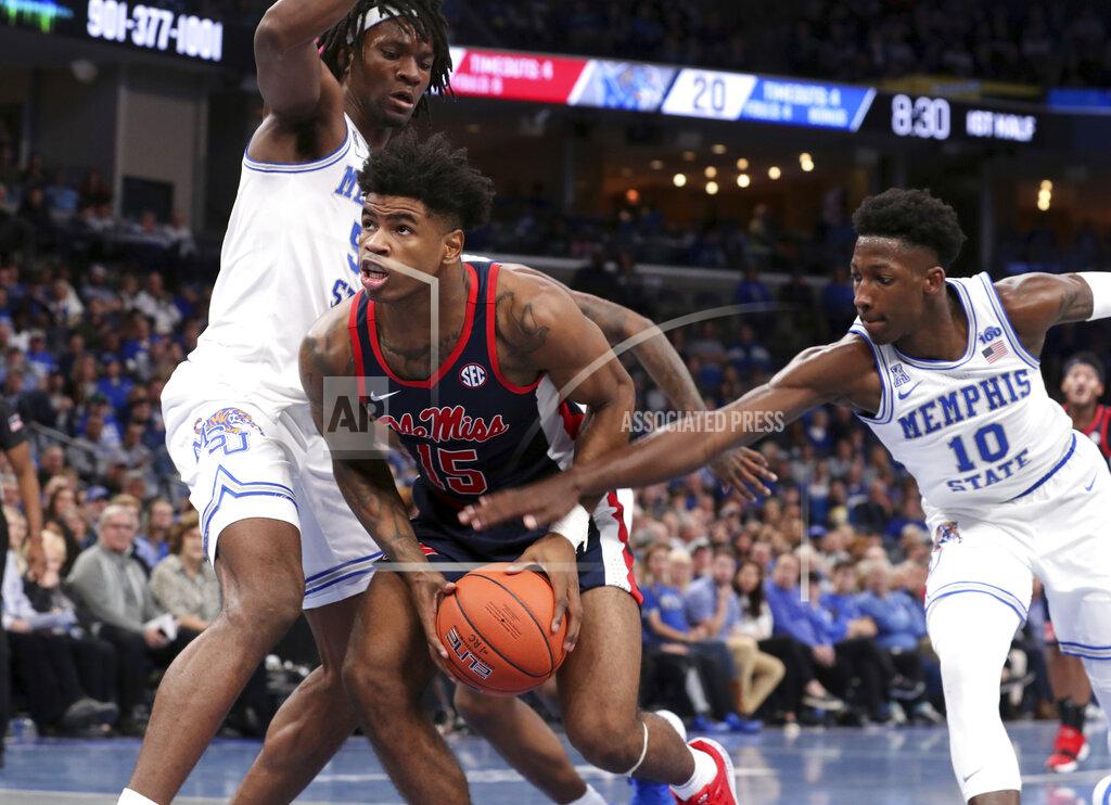 Karen Pulfer Focht Memphis' Damion Baugh (10) reaches in as Mississippi's Luis Rodriguez (15) looks to the basket in the first half of an NCAA college basketball game Saturday, Nov. 23, 2019, in Memphis, Tenn. (AP Photo/Karen Pulfer Focht)