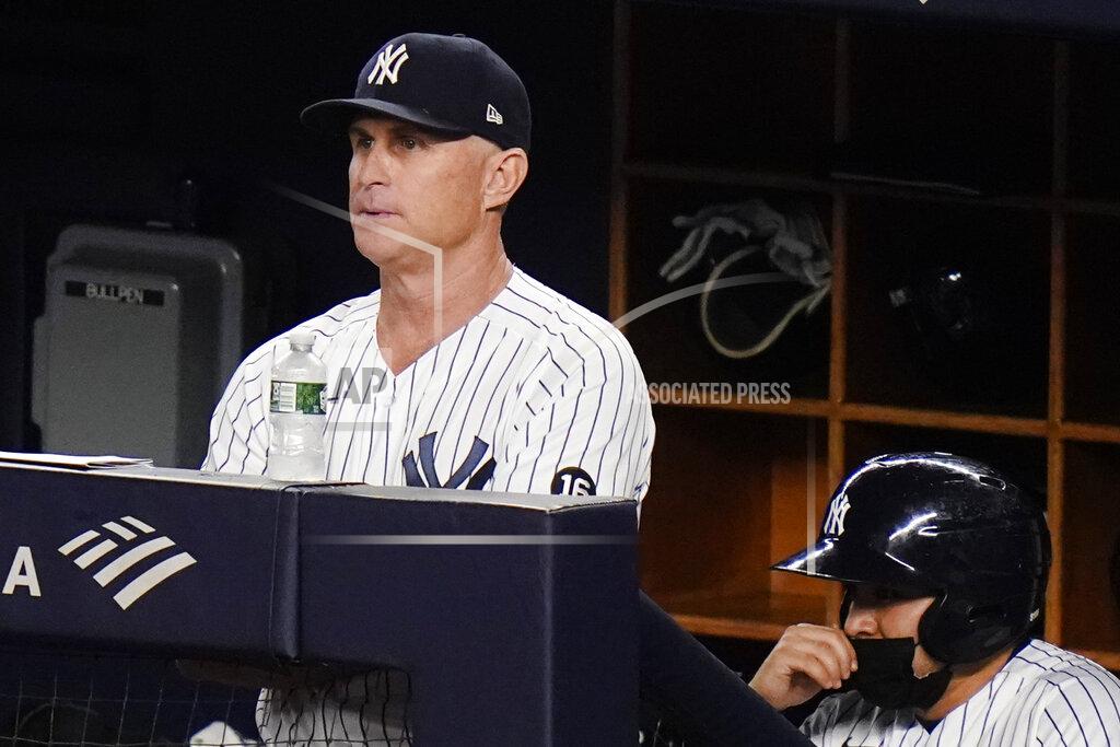 Frank Franklin Ii New York Yankees third base coach Phil Nevin, left, watches the eighth inning of a baseball game against the Boston Red Sox, Friday, June 4, 2021, in New York. (AP Photo/Frank Franklin II)