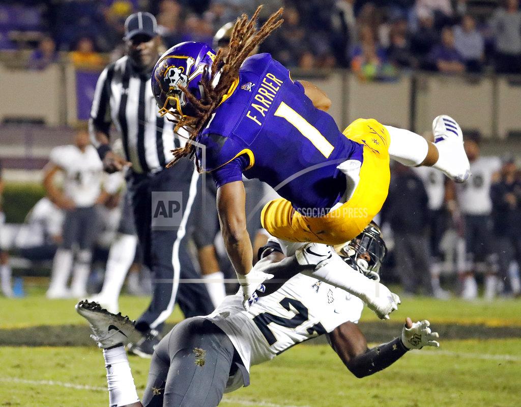 Karl B Deblaker East Carolina's Deondre Farrier (1) collides with Central Florida's Richie Grant (27) during the second half of an NCAA college football game in Greenville, N.C., Saturday, Oct. 20, 2018. UCF won 37-10. (AP Photo/Karl B DeBlaker)