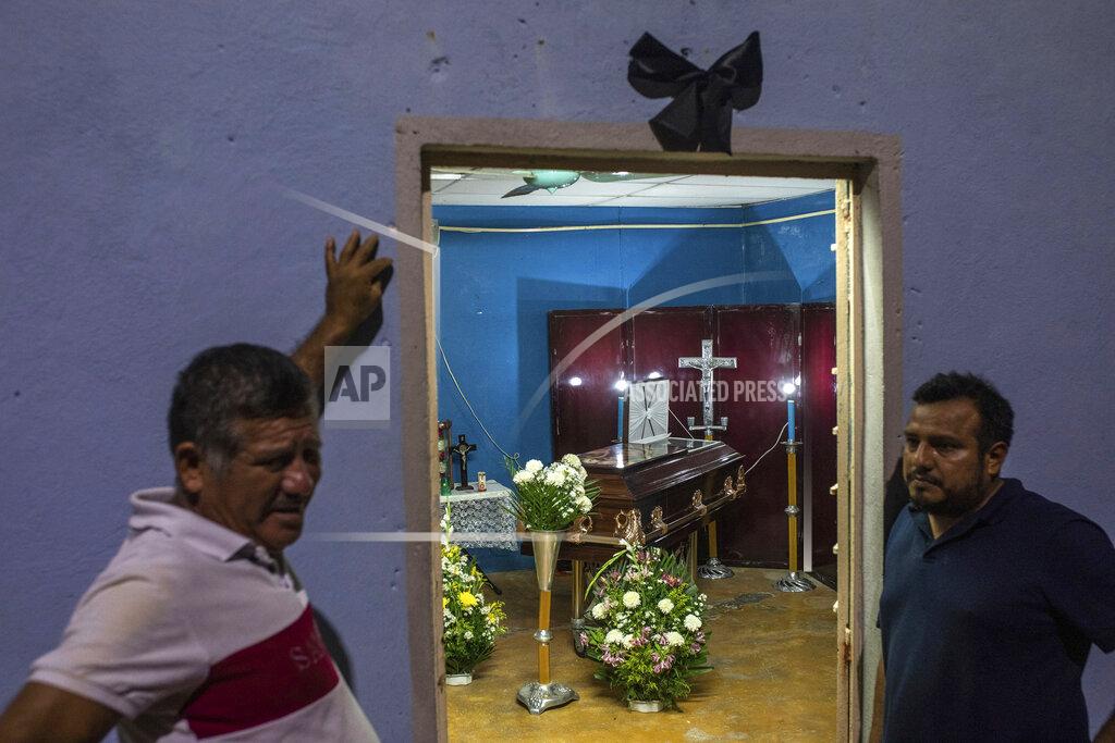 Felix Marquez A black ribbon hangs outside the family home of video-journalist Sheila Johana Garcia Olivera where her remains lay during her wake in Minatitlan, Veracruz state, Mexico, Tuesday, May 10, 2022. Garcia is one of two journalists from the online news site El Veraz in Cosoleacaque who were shot to death on May 9, raising to 11 the number of such killings in the country this year. (AP Photo/Felix Marquez)
