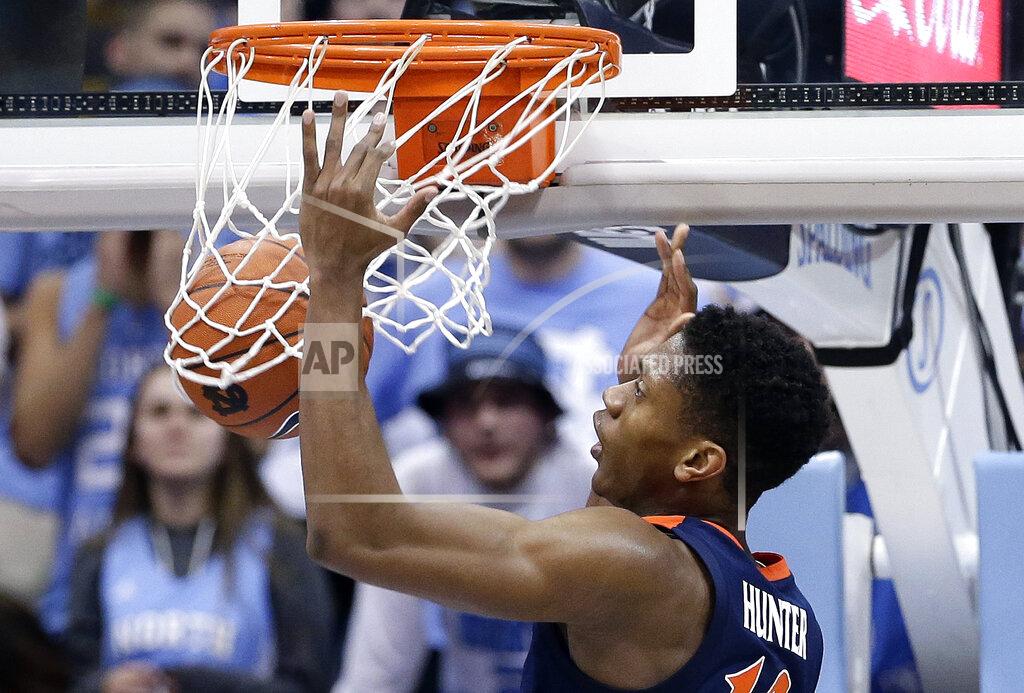 Gerry Broome Virginia's De'Andre Hunter dunks against North Carolina during the first half of an NCAA college basketball game in Chapel Hill, N.C., Monday, Feb. 11, 2019. (AP Photo/Gerry Broome)