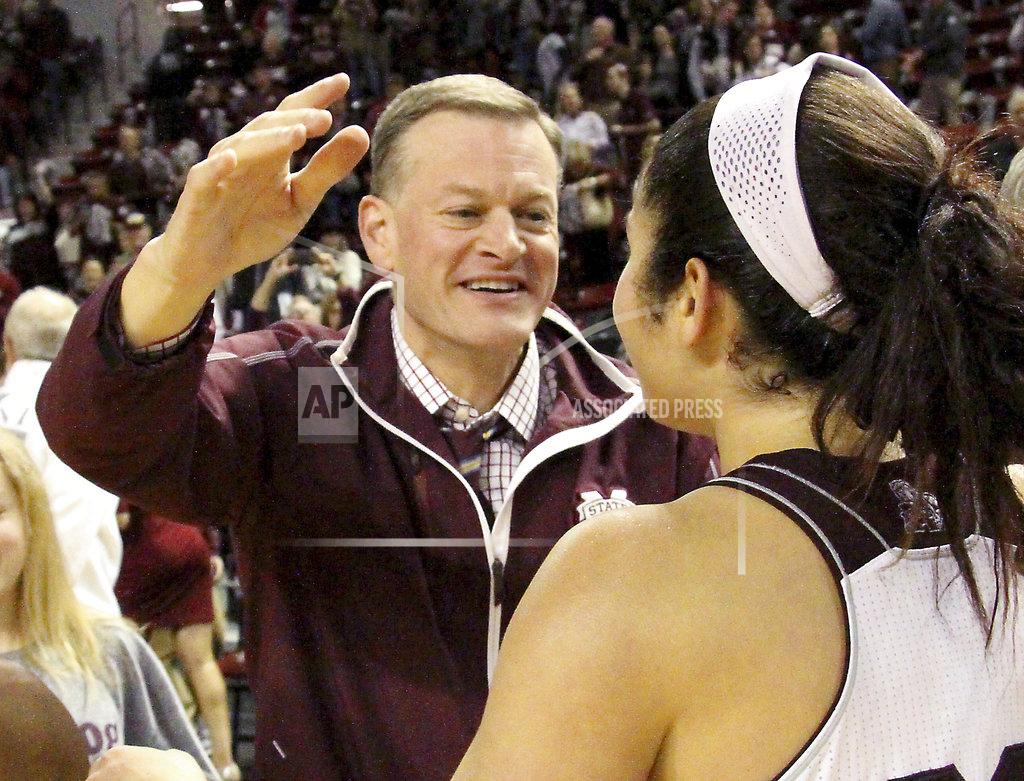 Jim Lytle FILE - In this Jan. 28, 2016, file photo, Mississippi State athletic director Scott Stricklin congratulates Dominique Dillingham following the team's NCAA college basketball game against Tennessee in Starkville, Miss. Stricklin is among three athletic directors representing Power Five leagues who are new members of the College Football Playoff selection committee. Nearly half of the 13 committee members are serving for the first time. There are six new members taking part in the process to determine the first ranking for this season. It is the biggest turnover since the original group in 2013. The first 2018 ranking comes out Tuesday night, Oct. 30, 2018. It will be the first of six rankings this season to determine who plays in the national semifinal games. (AP Photo/Jim Lytle, File)