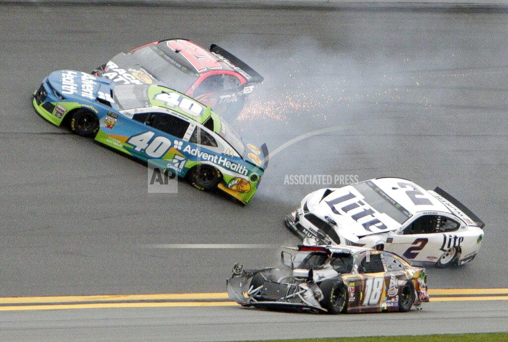 Darryl Graham Jamie McMurray (40), Martin Truex Jr. (19), Brad Keselowski (2) and Kyle Busch (18) get caught up in a multi-car crash during the NASCAR Clash auto race at Daytona International Speedway, Sunday, Feb. 10, 2019, in Daytona Beach, Fla. (AP Photo/Darryl Graham)