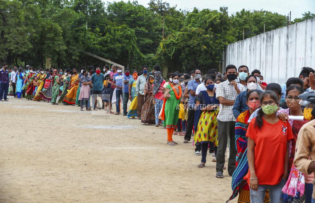 Mahesh Kumar A Hundreds of people line up to receive their second dose of vaccine against the coronavirus at the municipal ground in Hyderabad, India, Thursday, July 29, 2021. (AP Photo/Mahesh Kumar A.)