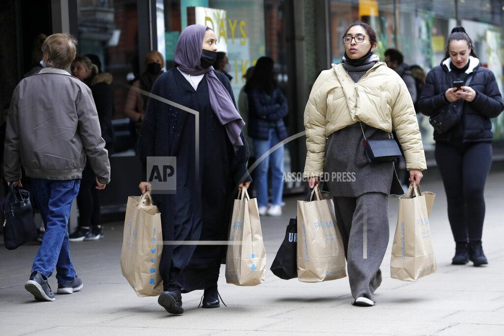 Kirsty Wigglesworth Women carrying shopping bags walk on Oxford Street in London, Monday, April 12, 2021. Millions of people in England will get their first chance in months for haircuts, casual shopping and restaurant meals on Monday, as the government takes the next step on its lockdown-lifting road map. (AP Photo/Kirsty Wigglesworth)