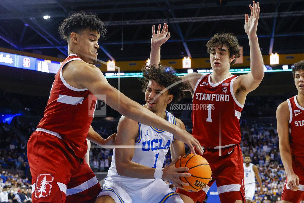 Ringo H.w. Chiu UCLA guard Jules Bernard, center, struggles to the ball while defended by Stanford forward Spencer Jones, left, and guard Isa Silva in the second half of an NCAA college basketball game Saturday, Jan. 29, 2022, in Los Angeles. (AP Photo/Ringo H.W. Chiu)
