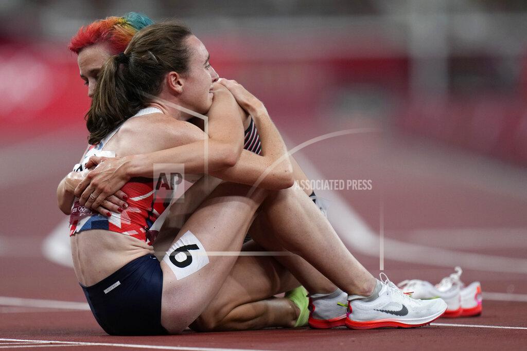 Petr David Josek Laura Muir, of Britain, is embraced by a competitor after her second place finish in the final of the women's 1,500-meters at the 2020 Summer Olympics, Friday, Aug. 6, 2021, in Tokyo. (AP Photo/Petr David Josek)