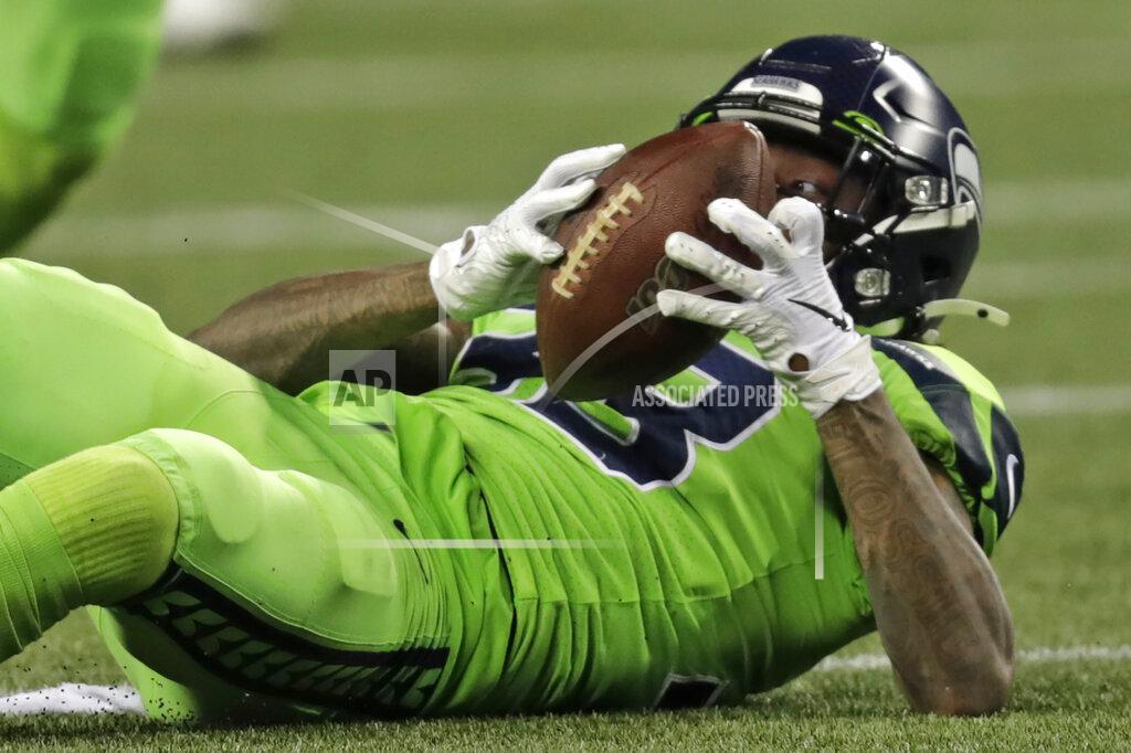 Stephen Brashear Seattle Seahawks free safety Tedric Thompson eyes the ball after he intercepted a Los Angeles Rams pass during the second half of an NFL football game Thursday, Oct. 3, 2019, in Seattle. (AP Photo/Stephen Brashear)