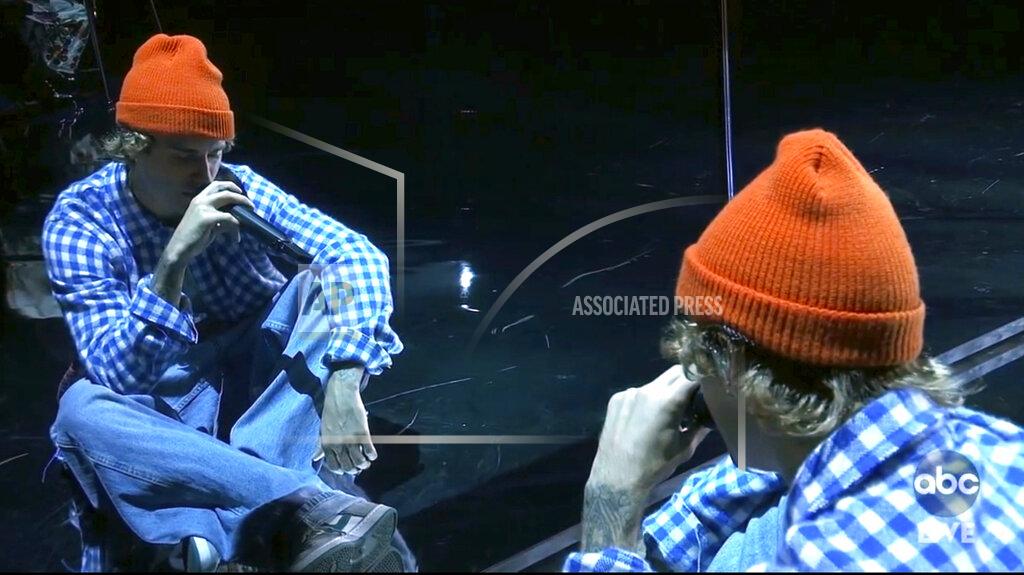 Uncredited In this screen shot provided by ABC on Sunday, Nov. 22, 2020, Justin Bieber performs at the American Music Awards at the Microsoft Theater in Los Angeles. (ABC via AP)