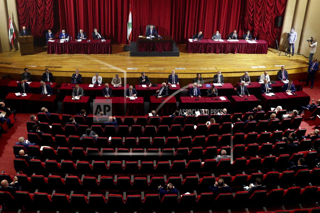 Bilal Hussein Parliament meets to confirm Lebanon's new government at a Beirut theater known as the UNESCO palace so that parliament members could observe social distancing measures imposed over the coronavirus pandemic, Lebanon, Monday, Sept. 20, 2021. A power outage and a broken generator briefly delayed the start of the parliament session for some 40 minutes before electricity came back on. (AP Photo/Bilal Hussein)