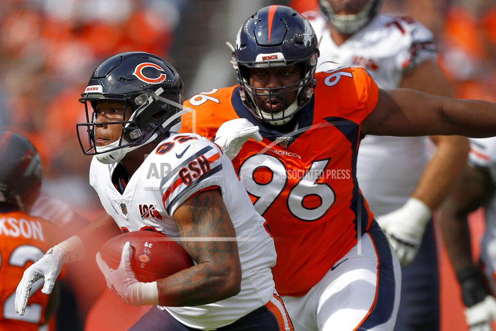 David Zalubowski Chicago Bears running back David Montgomery (32) is pursued by Denver Broncos defensive tackle Shelby Harris (96) during the first half of an NFL football game, Sunday, Sept. 15, 2019, in Denver. (AP Photo/David Zalubowski)