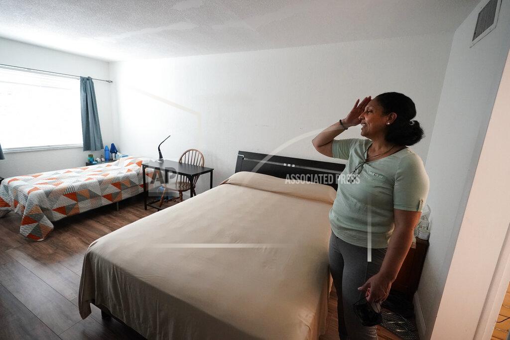 Wilfredo Lee Cristina Livingston recounts the problems she has had in her apartment including a leaking ceiling and mold, Friday, June 18, 2021, at her home in Bay Harbor Islands, Fla. The Biden administration on Thursday, June 24, extended the nationwide ban on evictions for a month to help millions of tenants unable to make rent payments during the coronavirus pandemic but said this is expected to be the last time it does so. Livingston, mother of two had lost her administrative assistant job during the pandemic, said she was relieved to hear it had been extended. (AP Photo/Wilfredo Lee)(AP Photo/Wilfredo Lee)
