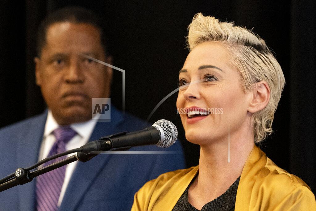Damian Dovarganes Republican conservative radio talk show host Larry Elder, left, with former actress and activist Rose McGowan, address a news conference at the Luxe Hotel Sunset Boulevard, Sunday, Sept. 12, 2021, in Los Angeles. Elder is running to replace Democratic Gov. Gavin Newsom in the Sept. 14 recall election. Democrats have an early edge in the California recall election that could remove Democratic Gov. Gavin Newsom from office. McGowan, who is known for her role in the "Scream" movie franchise, was one of the earliest of dozens of women to accuse Hollywood producer Harvey Weinstein of sexual misconduct, making her a major figure in the #MeToo movement. (AP Photo/Damian Dovarganes)