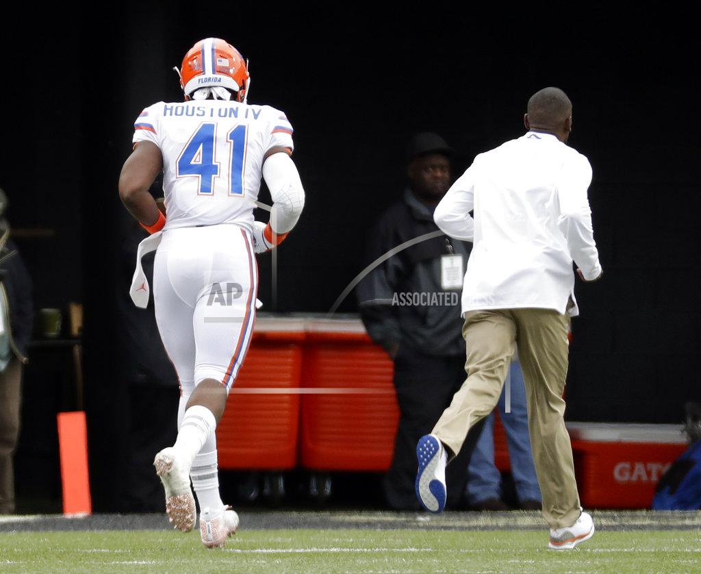 Mark Humphrey Florida linebacker James Houston IV (41) runs to the locker room after being ejected for targeting in the first half of an NCAA college football game against Vanderbilt Saturday, Oct. 13, 2018, in Nashville, Tenn. (AP Photo/Mark Humphrey)