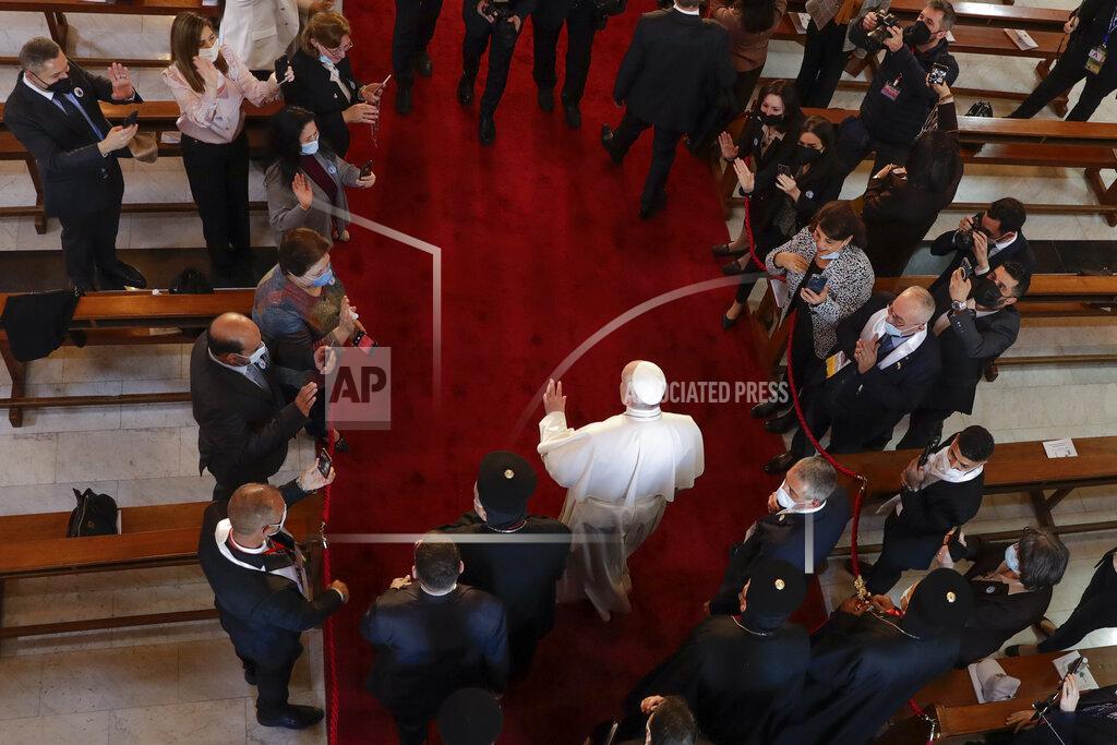 Andrew Medichini Pope Francis arrives for a meeting with bishops and priests, at the Sayidat al-Nejat (Our Lady of Salvation) Cathedral, in Baghdad, Iraq, Friday, March 5, 2021. Pope Francis has arrived in Iraq to urge the country's dwindling number of Christians to stay put and help rebuild the country after years of war and persecution, brushing aside the coronavirus pandemic and security concerns. (AP Photo/Andrew Medichini)