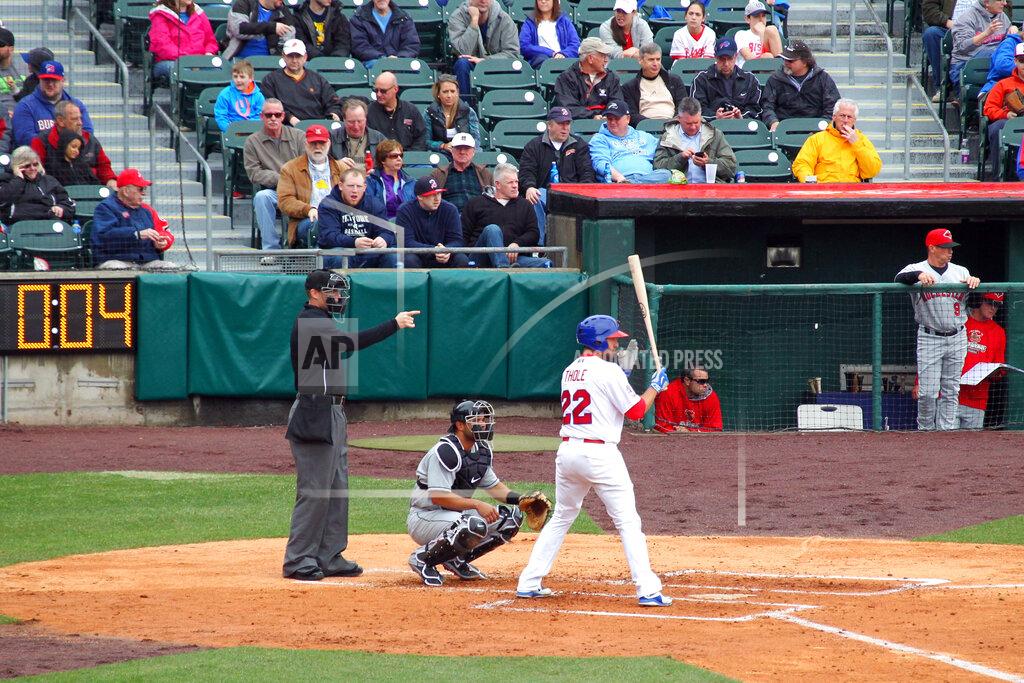 FILE - In this April 9, 2015, file photo, home plate umpire Seth Buckminster signals for the pitch as Buffalo Bisons batter Josh Thole (22) steps into the box during a Triple-A baseball game between the Bisons and Rochester Red Wings in Buffalo, N.Y. The displaced Toronto Blue Jays will play in Buffalo, New York, this year amid the pandemic. An official familiar with the matter told The Associated Press on Friday that the Blue Jays will play at Sahlen Field. The official spoke on condition of anonymity as they were not authorized to speak publicly ahead of an announcement. (AP Photo/Bill Wippert, File