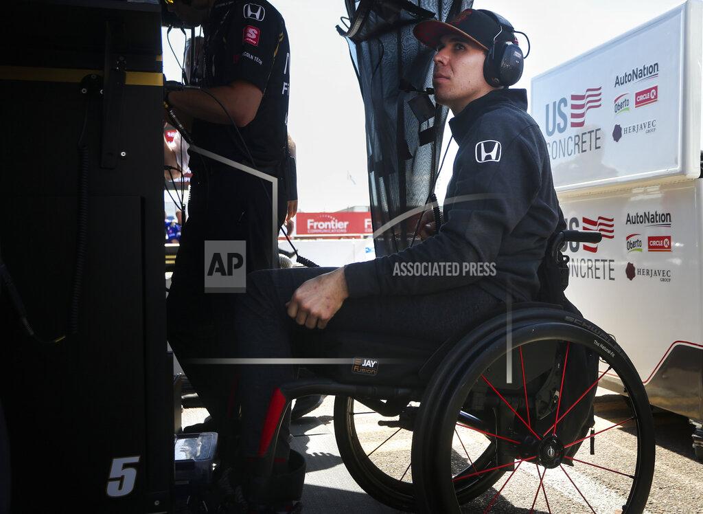 Dirk Shadd Robert Wickens sits in the pit area at the IndyCar Grand Prix of St. Petersburg auto race in St. Petersburg, Fla., Friday, March 8, 2019. Wickens returns to a race track for the first time since he suffered a major spinal cord injury in a crash six months ago. (Dirk Shadd/Tampa Bay Times via AP)