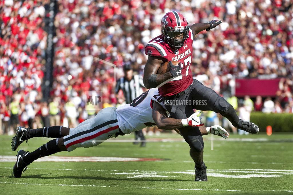 Sean Rayford South Carolina running back Ty'Son Williams (27) runs with the ball against Georgia defensive back J.R. Reed (20) during the first half of an NCAA college football game Saturday, Sept. 8, 2018, in Columbia, S.C. (AP Photo/Sean Rayford)