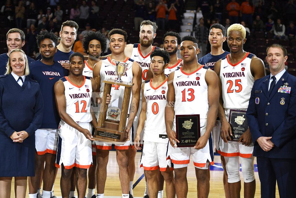 Jessica Hill Virginia poses with the 2019 Basketball Hall of Fame Tip Off Tournament championship trophy after their win over Arizona State in an NCAA college basketball game, Sunday, Nov. 24, 2019, in Uncasville, Conn. (AP Photo/Jessica Hill)