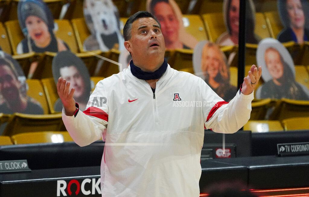 David Zalubowski FILE - Arizona coach Sean Miller looks up at the overhead video screen to watch a foul committed by guard Bennedict Mathurin against Colorado forward Evan Battey late in the second half of an NCAA college basketball game in Boulder, Colo., in this Saturday, Feb. 6, 2021, file photo. Arizona has parted ways with men's basketball coach Sean Miller as the program awaits its fate in an NCAA infractions investigation, a person with knowledge of the situation told The Associated Press. The person told the AP on condition of anonymity Wednesday, April 7, 2021, because no official announcement has been made.( (AP Photo/David Zalubowski, File)