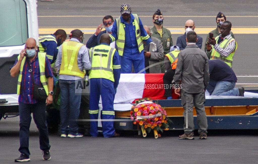 Justin Kabumba The coffins of Italian ambassador to Congo Luca Attanasio and Carabinieri officer Vittorio Iacovacci, draped with the Italian flag, are prepared to be loaded onto an airplane for repatriation to Italy, at the airport in Goma, North Kivu province, Congo Tuesday, Feb. 23, 2021. An Italian Carabinieri unit is expected in Congo Tuesday to investigate the killings of the Italian ambassador to Congo, an Italian Carabinieri police officer and their driver in the country's east. (AP Photo/Justin Kabumba)