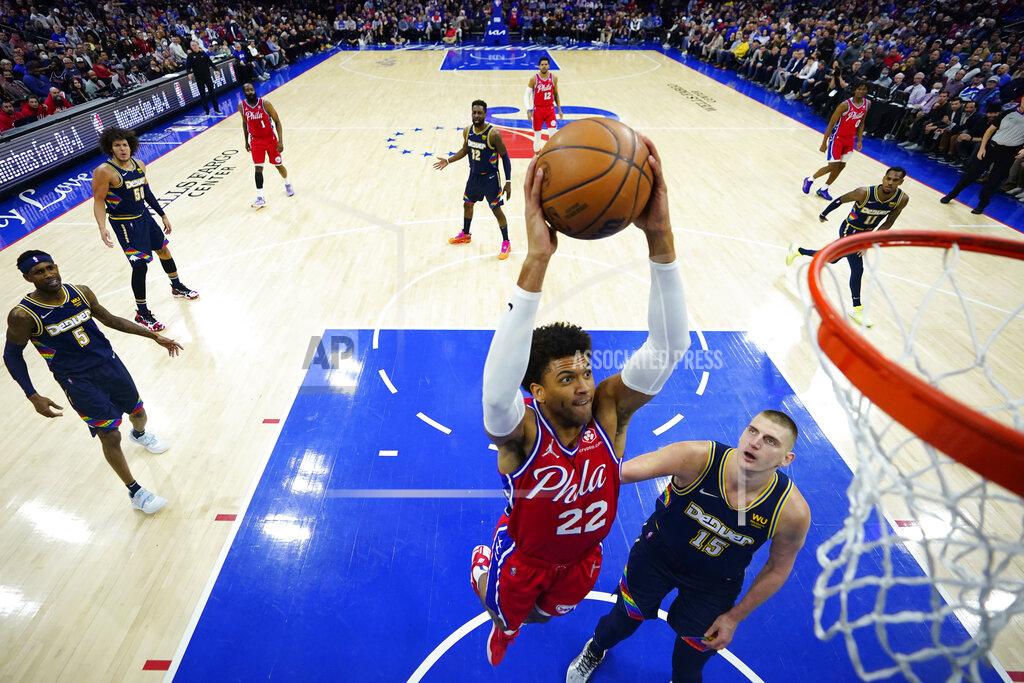Matt Slocum Philadelphia 76ers' Matisse Thybulle, left, goes up for a dunk against Denver Nuggets' Nikola Jokic during the first half of an NBA basketball game, Monday, March 14, 2022, in Philadelphia. (AP Photo/Matt Slocum)