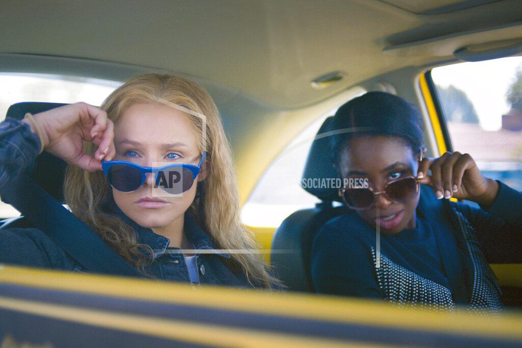 Uncredited This image released by STX Films shows Kristen Bell, left, and Kirby Howell-Baptiste in a scene from "Queenpins." (STX Films via AP)