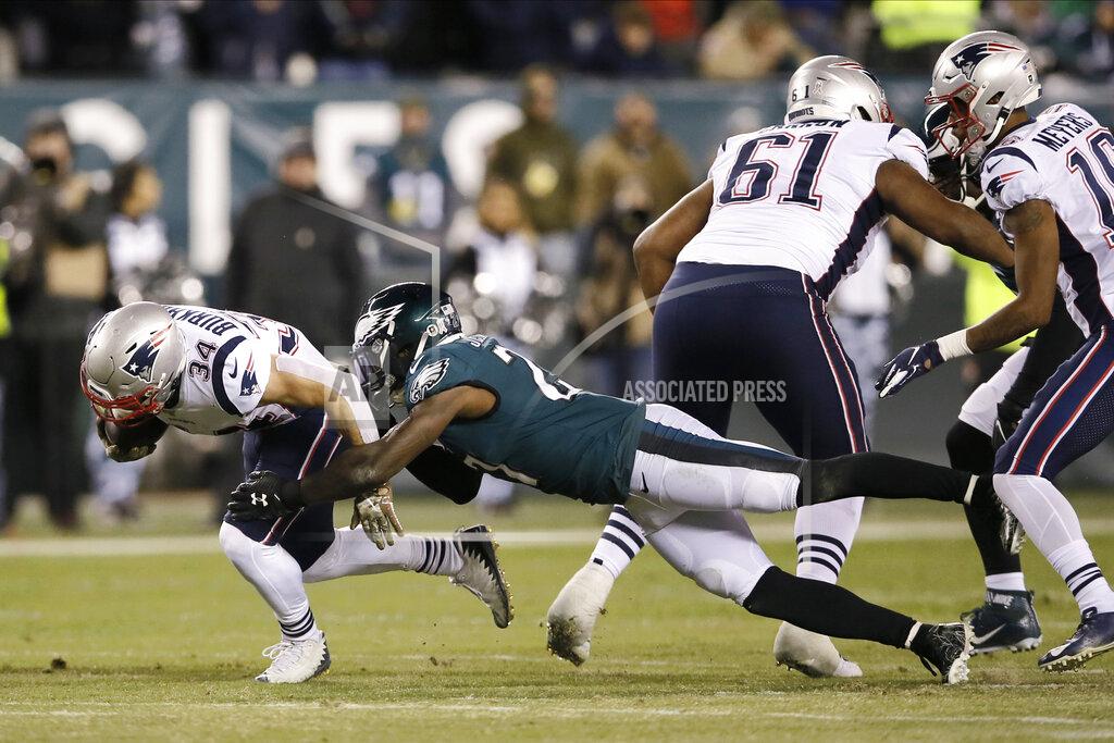 Michael Perez New England Patriots' Rex Burkhead (34) is tackled by Philadelphia Eagles' Malcolm Jenkins (27) during the first half of an NFL football game, Sunday, Nov. 17, 2019, in Philadelphia. (AP Photo/Michael Perez)