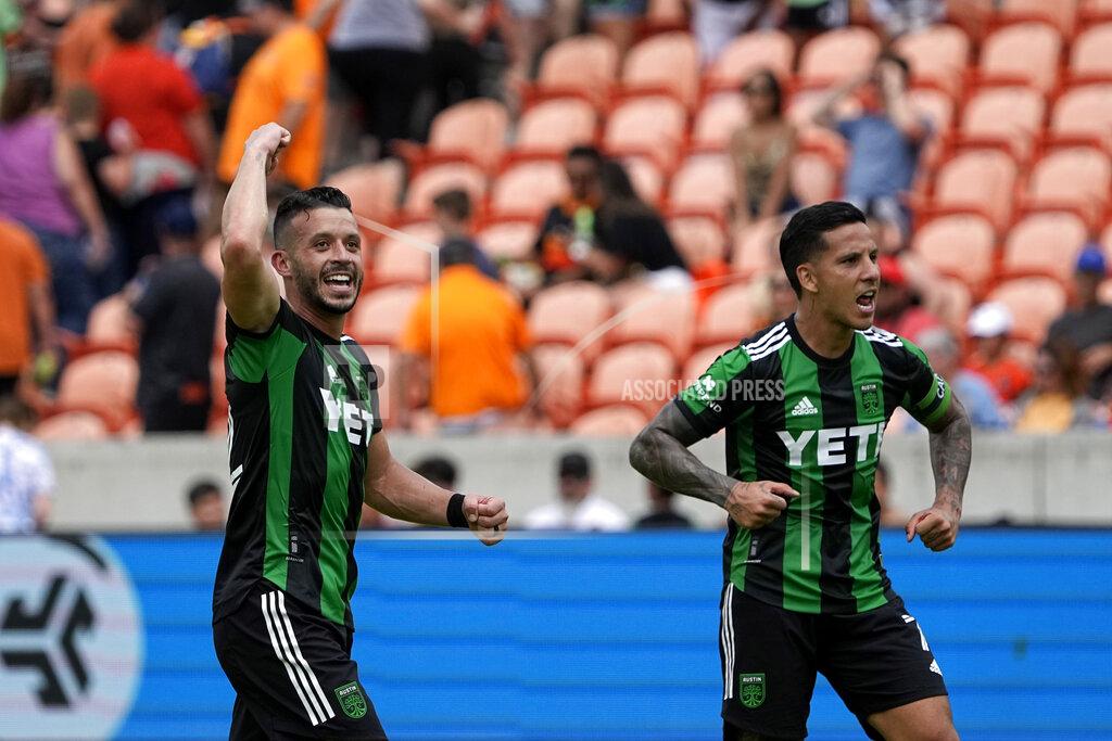 David J. Phillip Austin FC's Felipe Martins, left, and Sebastián Driussi (7) celebrate after a MLS soccer match against the Houston Dynamo Saturday, April 30, 2022, in Houston. Austin FC won 2-1. (AP Photo/David J. Phillip)