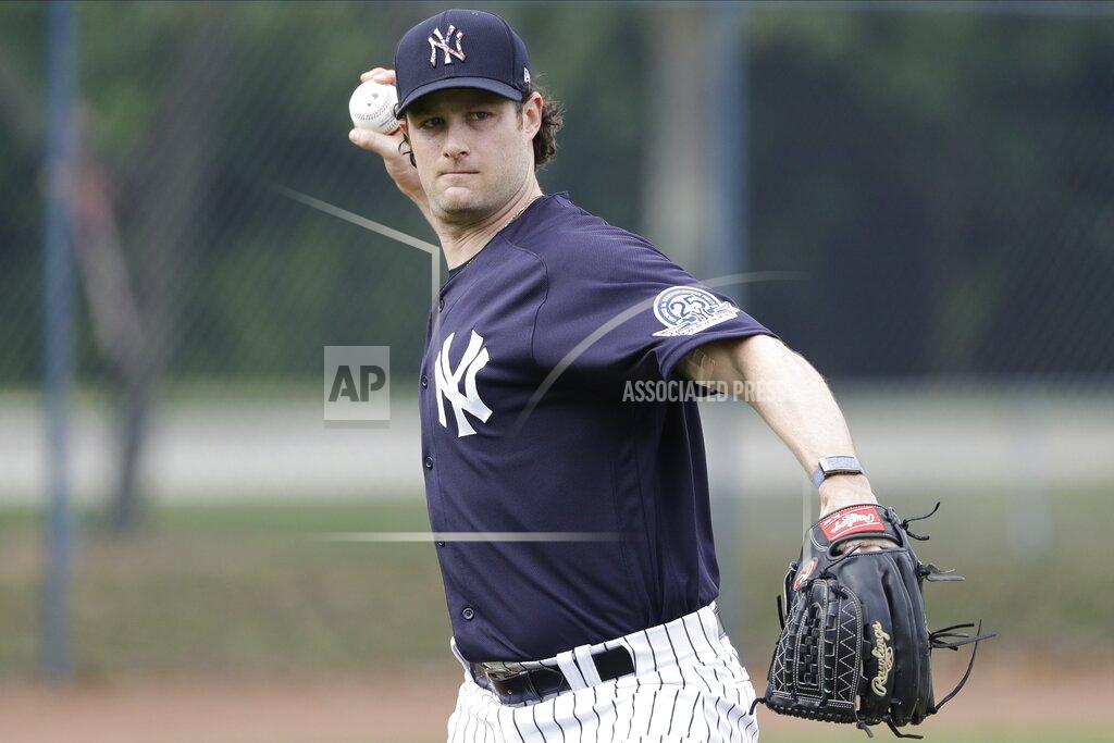 New York Yankees' Gerrit Cole throws to first base during a spring training baseball workout Thursday, Feb. 13, 2020, in Tampa, Fla. (AP Photo/Frank Franklin II)