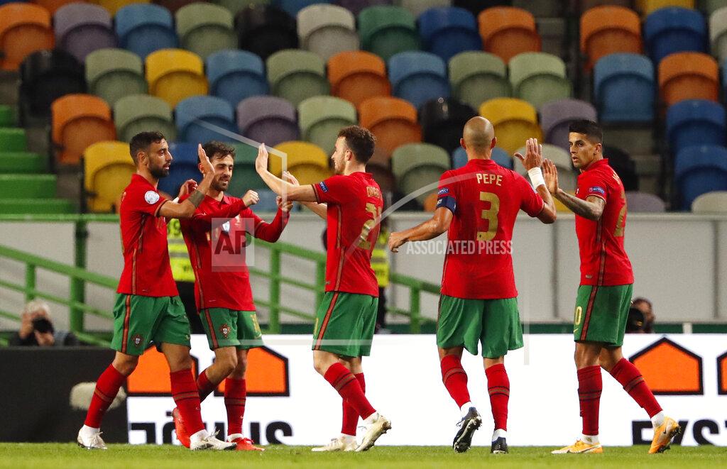 Armando Franca Portugal's Diogo Jota, centre, celebrates with teammates after scoring his side's third goal during the UEFA Nations League soccer match between Portugal and Sweden at the Jose Alvalade stadium in Lisbon, Portugal, Wednesday, Oct. 14, 2020. (AP Photo/Armando Franca)