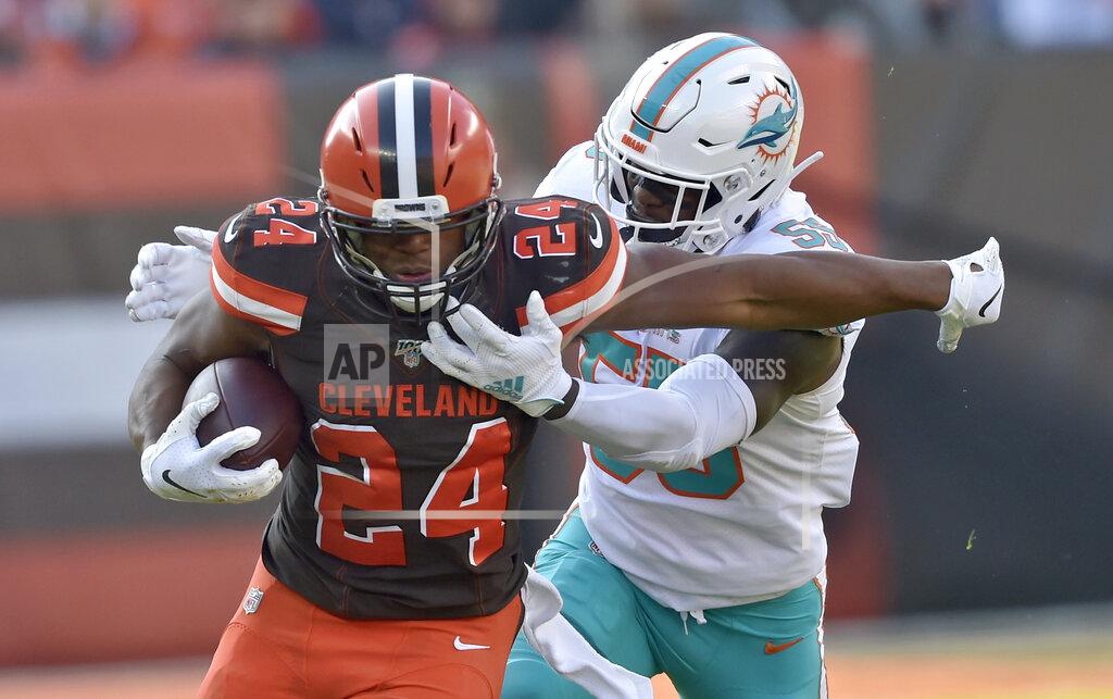 David Richard Cleveland Browns running back Nick Chubb (24) rushes against Miami Dolphins outside linebacker Jerome Baker (55) during the first half of an NFL football game, Sunday, Nov. 24, 2019, in Cleveland. (AP Photo/David Richard)