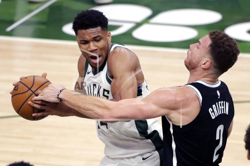 Aaron Gash Milwaukee Bucks' Giannis Antetokounmpo drives to the basket against Brooklyn Nets' Blake Griffin during the first half of an NBA basketball game Tuesday, May 4, 2021, in Milwaukee. (AP Photo/Aaron Gash)