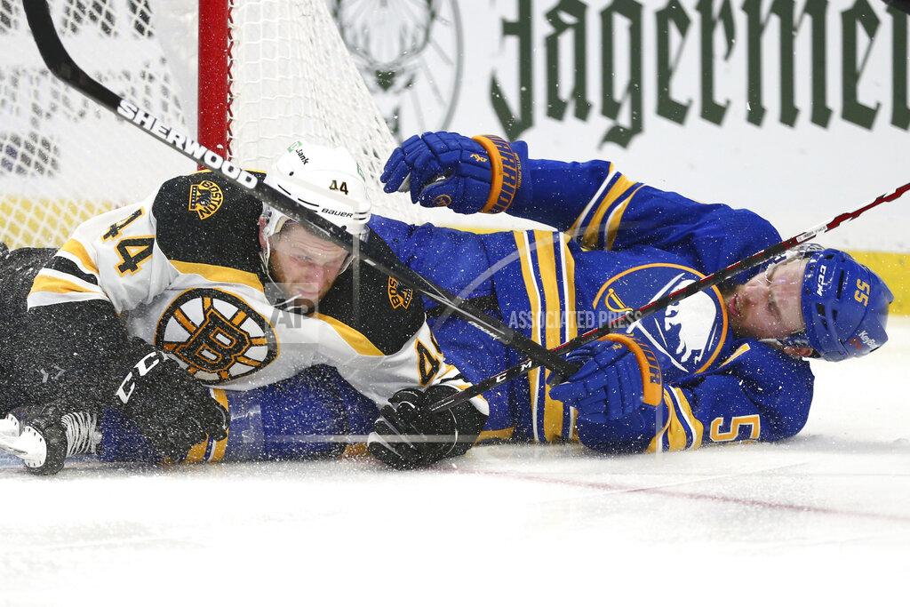 Jeffrey T. Barnes Buffalo Sabres defenseman Rasmus Ristolainen (55) and Boston Bruins defenseman Steven Kampfer (44) crash to the ice during the second period of an NHL hockey game Thursday, April 22, 2021, in Buffalo, N.Y. (AP Photo/Jeffrey T. Barnes)