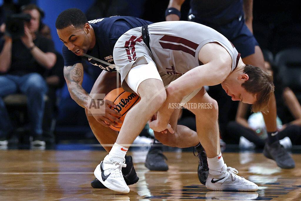 Adam Hunger Xavier's Dwon Odom takes the ball from Virginia Tech's Storm Murphy during the first half of an NCAA college basketball game in the NIT Season Tip-Off tournament Friday, Nov. 26, 2021, in New York. (AP Photo/Adam Hunger)