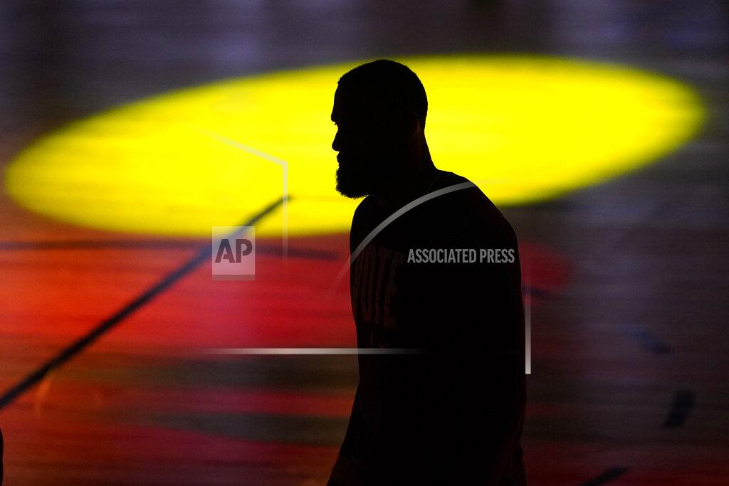 Mark J. Terrill FILE - In this Oct. 11, 2020, file photo, Los Angeles Lakers' LeBron James (23) is seen silhouetted during introductions prior to Game 6 of basketball's NBA Finals against the Miami Heat in Lake Buena Vista, Fla. James was announced Saturday, Dec. 26, as the winner of The Associated Press’ Male Athlete of the Year award for a record-tying fourth time. (AP Photo/Mark J. Terrill, File)
