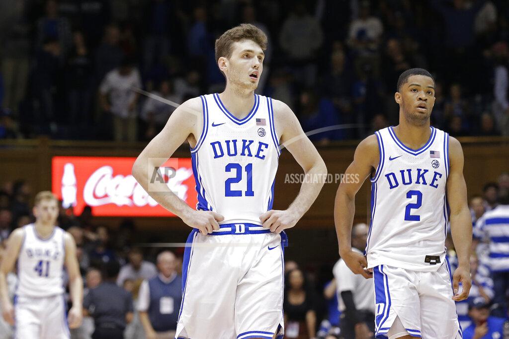 Gerry Broome Duke forward Matthew Hurt (21) and guard Cassius Stanley (2) react following the team's loss to Stephen F. Austin in overtime of an NCAA college basketball game in Durham, N.C., Tuesday, Nov. 26, 2019. (AP Photo/Gerry Broome)