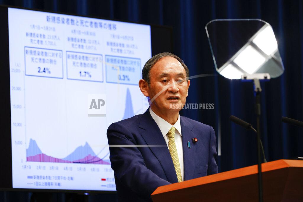Rodrigo Reyes Marin Japan's Prime Minister Yoshihide Suga speaks during a press conference at the prime minister's official residence on Tuesday, Sept. 28, 2021, in Tokyo. Suga announced the coronavirus state of emergency will end Thursday so the economy can be reactivated as infections slow. (Rodrigo Reyes Marin/Pool Photo via AP)