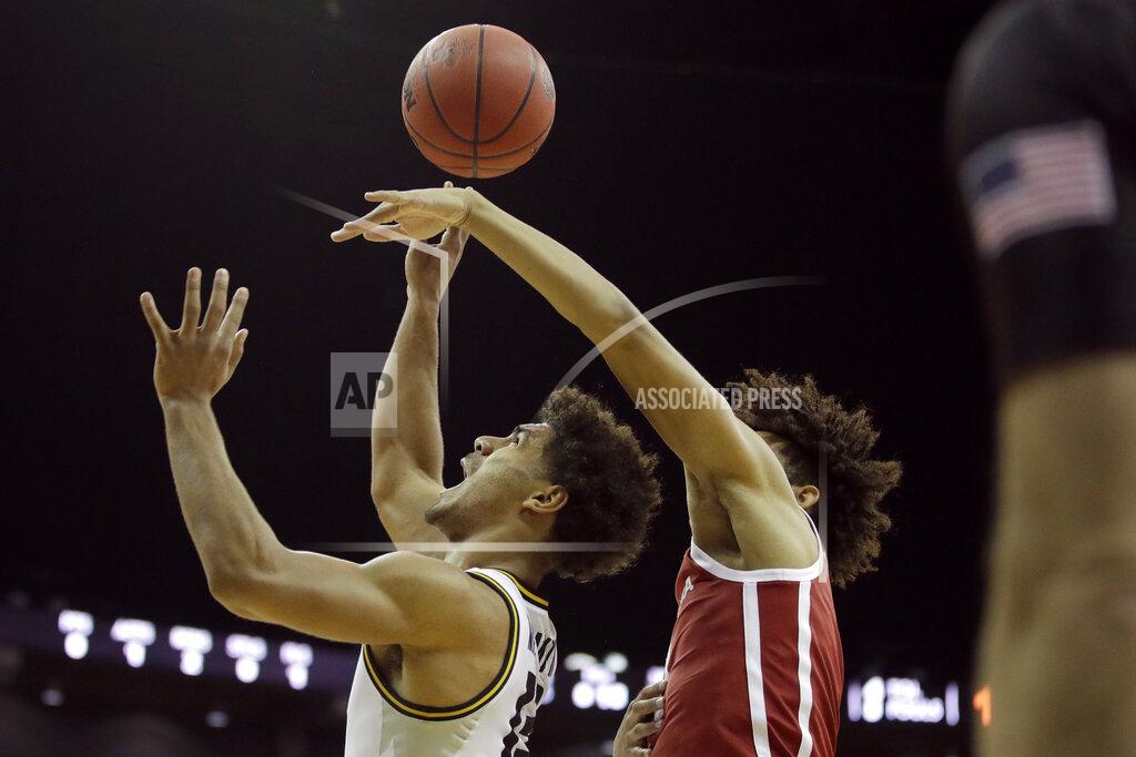 Charlie Riedel Oklahoma forward Jalen Hill, right, tries to block a shot by Missouri guard Mark Smith (13) during the first half of an NCAA college basketball game, Tuesday, Nov. 26, 2019, in Kansas City, Mo. (AP Photo/Charlie Riedel)