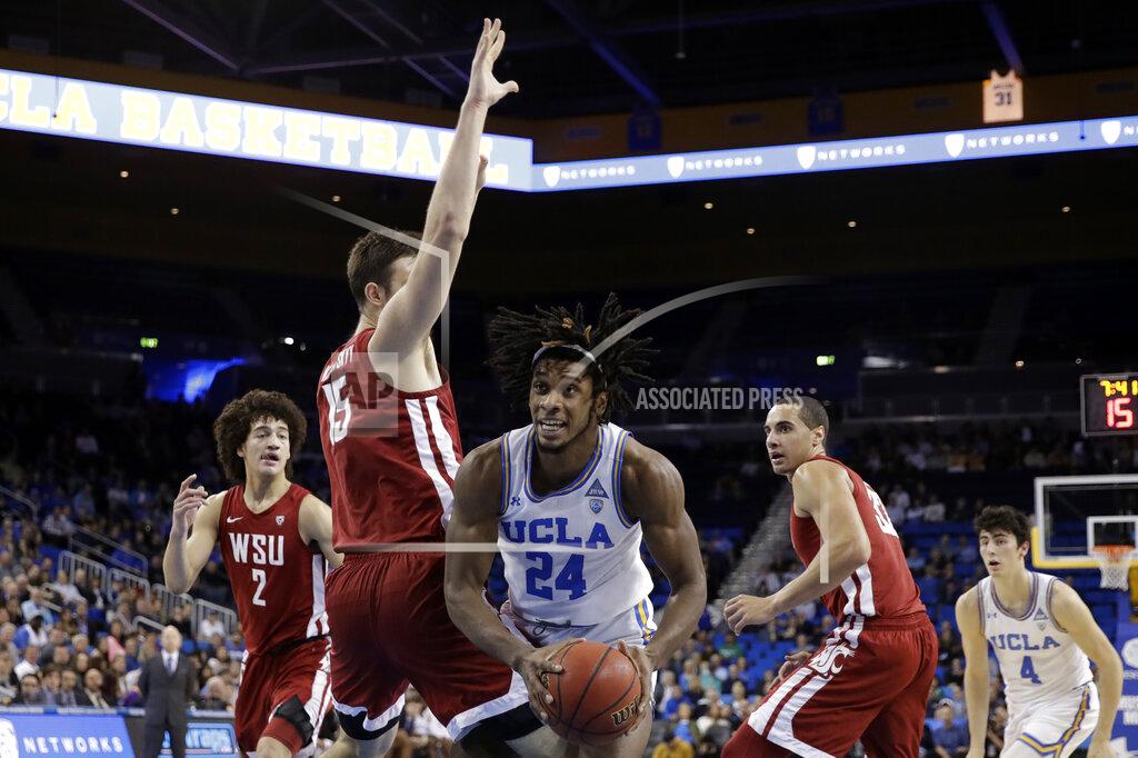 Marcio Jose Sanchez UCLA forward Jalen Hill (24) is defended by Washington State center Volodymyr Markovetskyy (15) during the first half of an NCAA college basketball game Thursday, Feb. 13, 2020, in Los Angeles. (AP Photo/Marcio Jose Sanchez)
