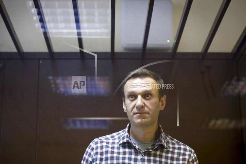 Alexander Zemlianichenko FILE - In this Feb. 20, 2021, file photo, Russian opposition leader Alexei Navalny stands in a cage in the Babuskinsky District Court in Moscow, Russia. Russia is holding three days of voting and there's no expectation that United Russia, the party devoted to President Vladimir Putin, will lose its dominance in the State Duma. The main question is whether the party will retain its two-thirds majority that allows it to amend the constitution. Another question is whether the Smart Voting strategy devised by Navalny will prove viable against United Russia. (AP Photo/Alexander Zemlianichenko, File)