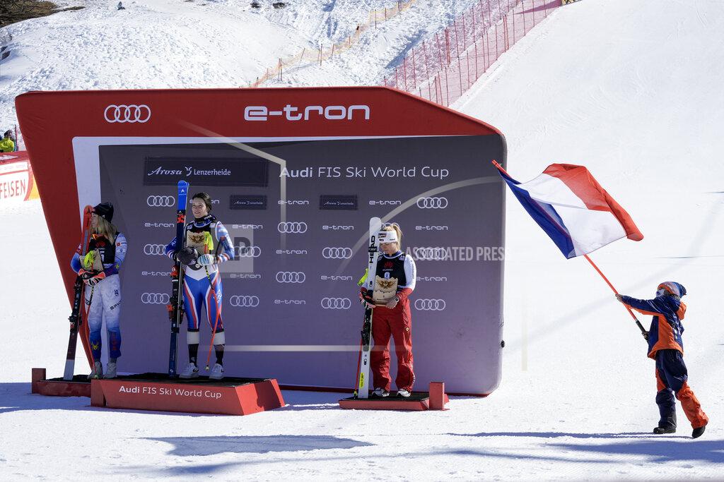 Giovanni Auletta From left, second placed United States' Mikaela Shiffrin, winner France's Romane Miradoli and third placed Switzerland's Lara Gut Behrami celebrate on the podium an alpine ski, women's World Cup super-G, in Lenzerheide, Switzerland, Saturday, March 5, 2022. (AP Photo/Giovanni Auletta)