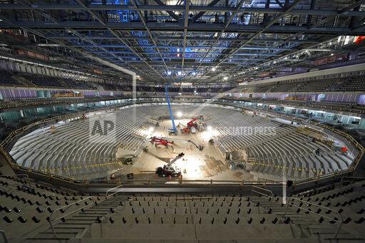 FILE- In this June 3, 2021, file photo, construction continues at the UBS Arena, the future home of the New York Islanders NHL hockey team, in Elmont, N.Y. As the Islanders prepare for the anticipated opening of their new home next month, they will begin with 13 straight road games — the longest such stretch in NHL history to start a season — while construction is completed. (AP Photo/Seth Wenig, File)